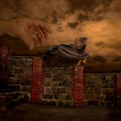 A girl runs across a wall through the fog as a large hand reaches for her.