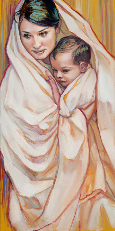 Baby Jesus being held by his mother Mary.